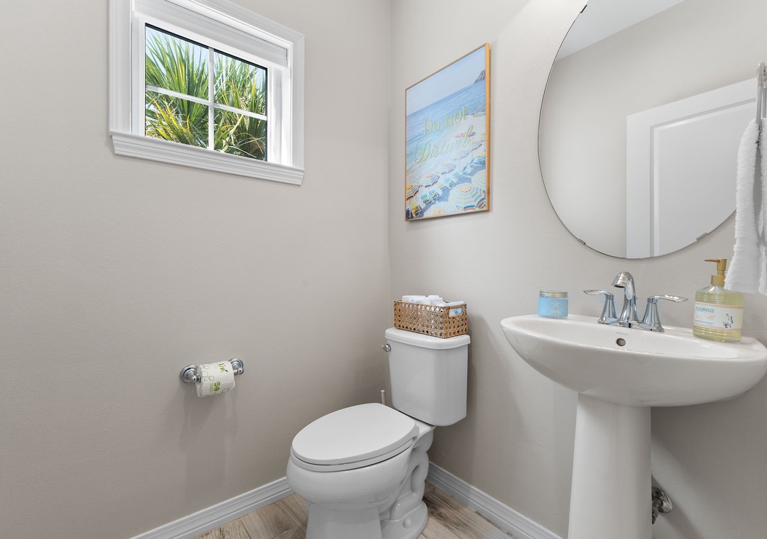 Turtles Nest- Step into your bright, serene bathroom with coastal-inspired touches and a peaceful glimpse of palm fronds through the window, making every refresh feel like a mini escape.