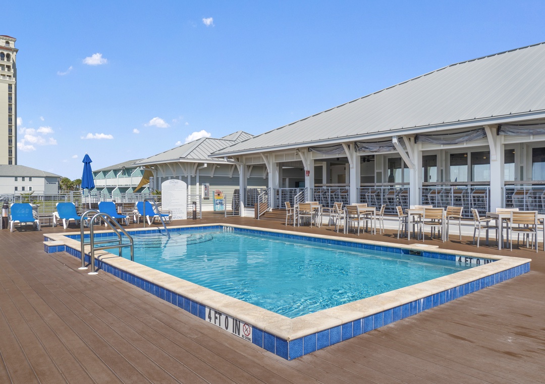 The Lost Key Beach Club Dive into your relaxing rooftop escape — sparkling pool, lounge chairs under the sun, and breezy covered seating ready for your morning coffee or afternoon chill.