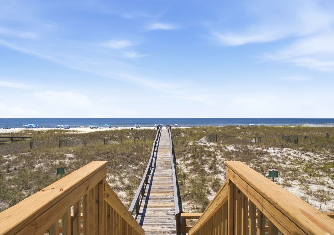 A wooden boardwalk leads directly from the property to pristine sandy shores and sparkling Gulf waters, offering effortless beach access for your coastal escape.