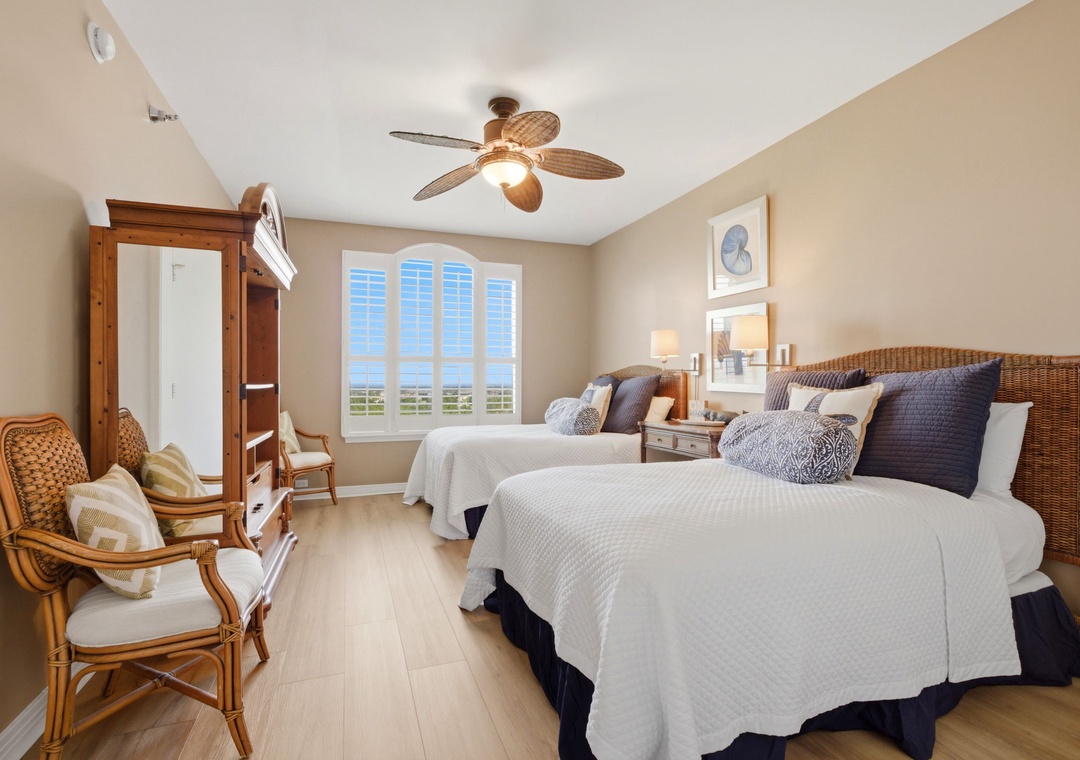Beach Colony T PH1D- Sink into crisp white linens in this coastal-inspired bedroom, where natural wicker and warm wood tones create a serene retreat. Your tropical ceiling fan keeps you cool while ocean views peek through plantation shutters.