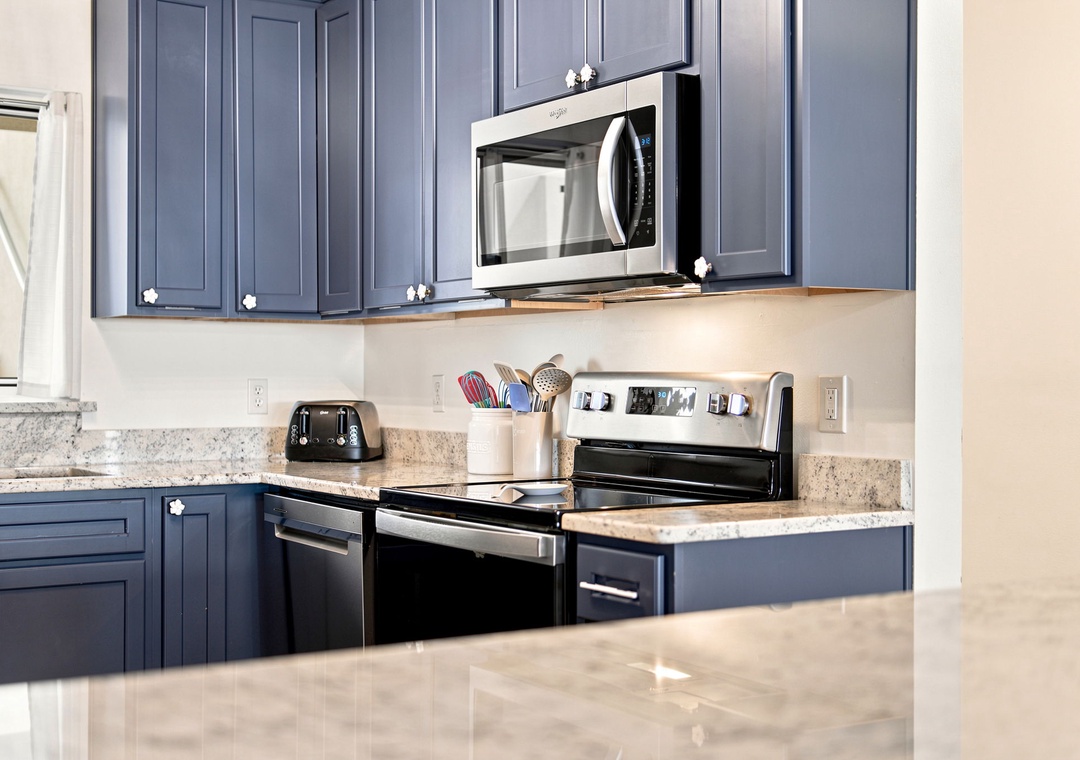 Sandy Key 411- Step into your fully equipped kitchen with sleek granite countertops, modern appliances, and all the essentials to whip up your favorite meals during your stay.