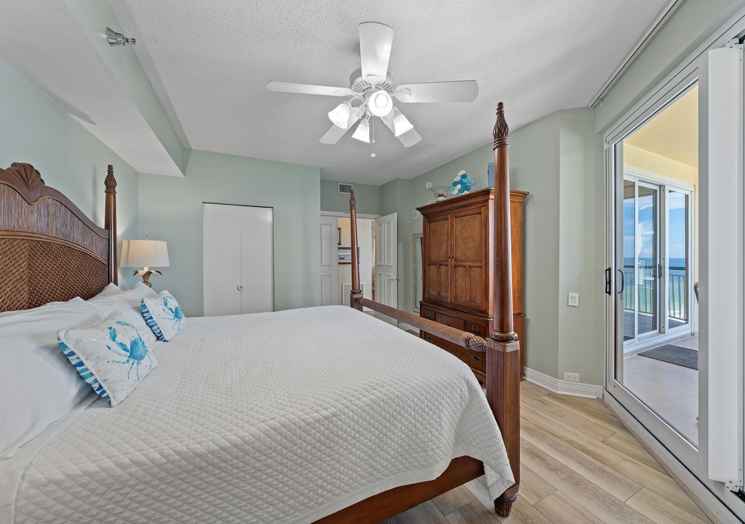 Beach Colony T15B- Wake up to soft sea breezes in your coastal bedroom. The peaceful palette and ceiling fan keep you comfortable, while your private balcony invites morning coffee with an ocean view.