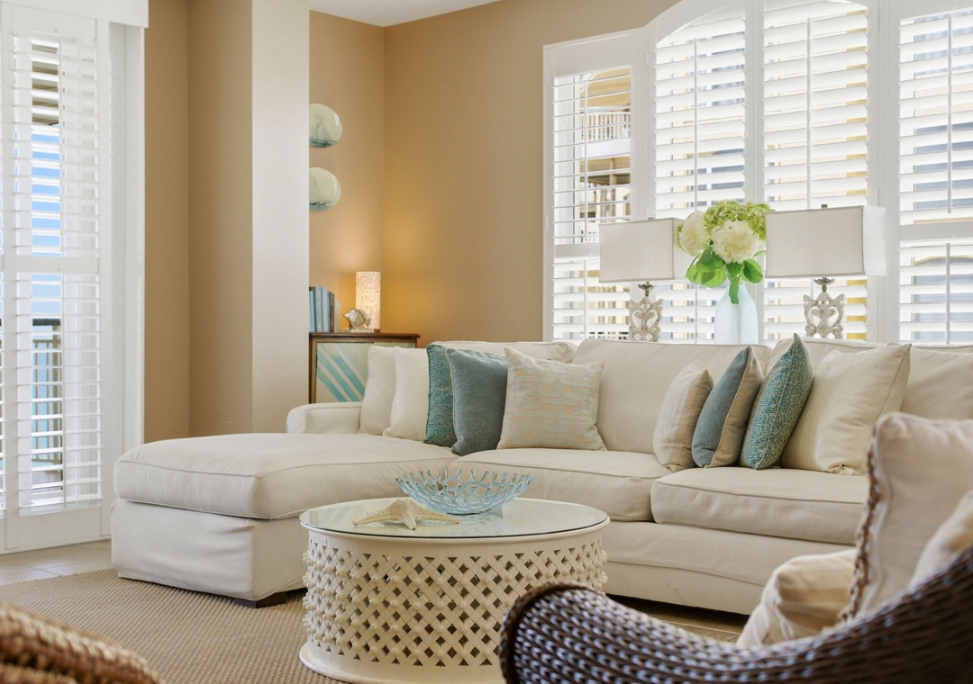 Beach Colony T PH1D-Sink into this plush sectional after a long day exploring. Soft coastal hues, natural light through plantation shutters, and elegant touches create a calming retreat for your stay.