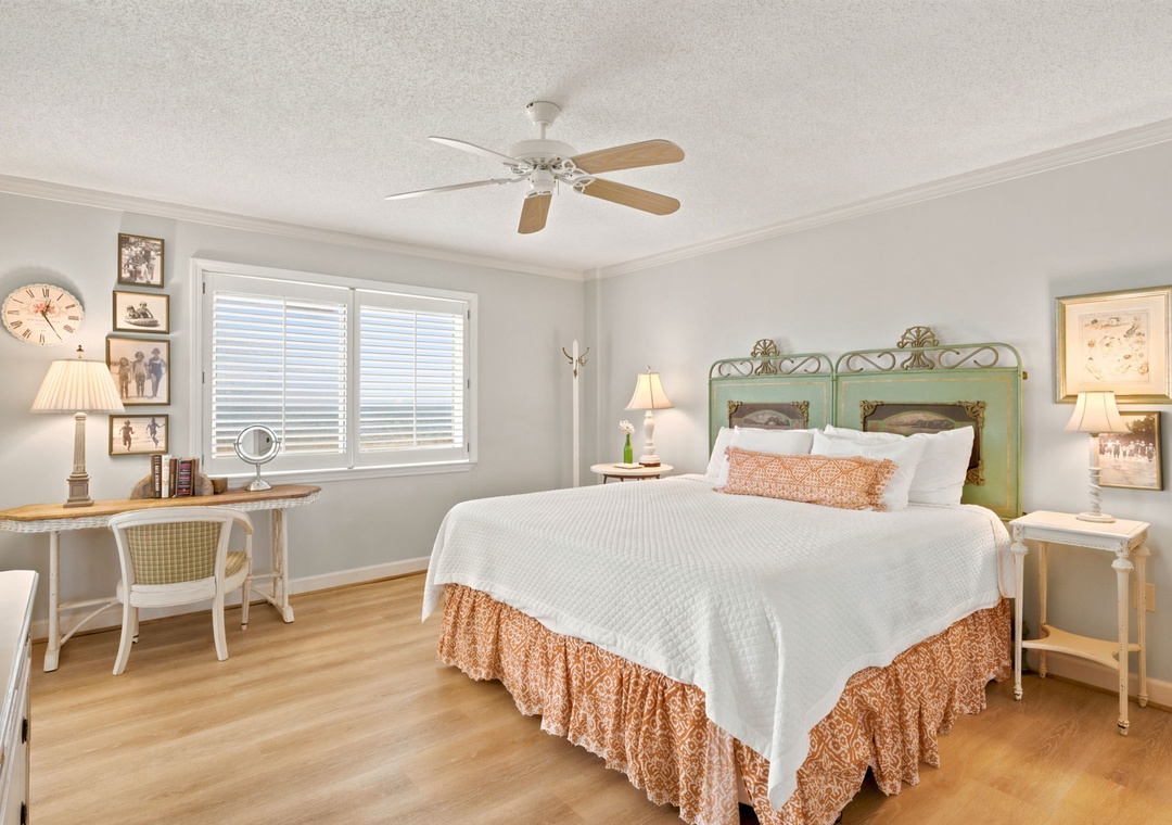Sandy Key 338- Unwind in this charming bedroom where coastal elegance meets comfort. Soft linens, warm wood floors, and vintage-inspired décor create your peaceful retreat after a day exploring.
