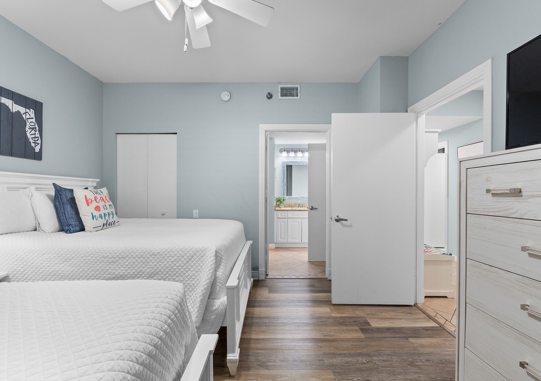 Beach Colony Tower 10C- Sink into the crisp comfort of your coastal-inspired bedroom, where soft blues and whites create a calming retreat after a day of exploring nearby beaches.