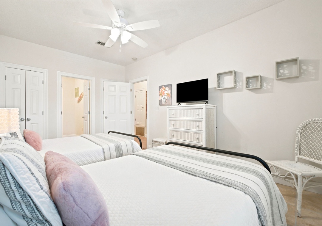 Sink into plush beds with soft linens and fluffy pillows. Your own TV awaits for cozy nights in, while the ceiling fan keeps you cool and comfortable.