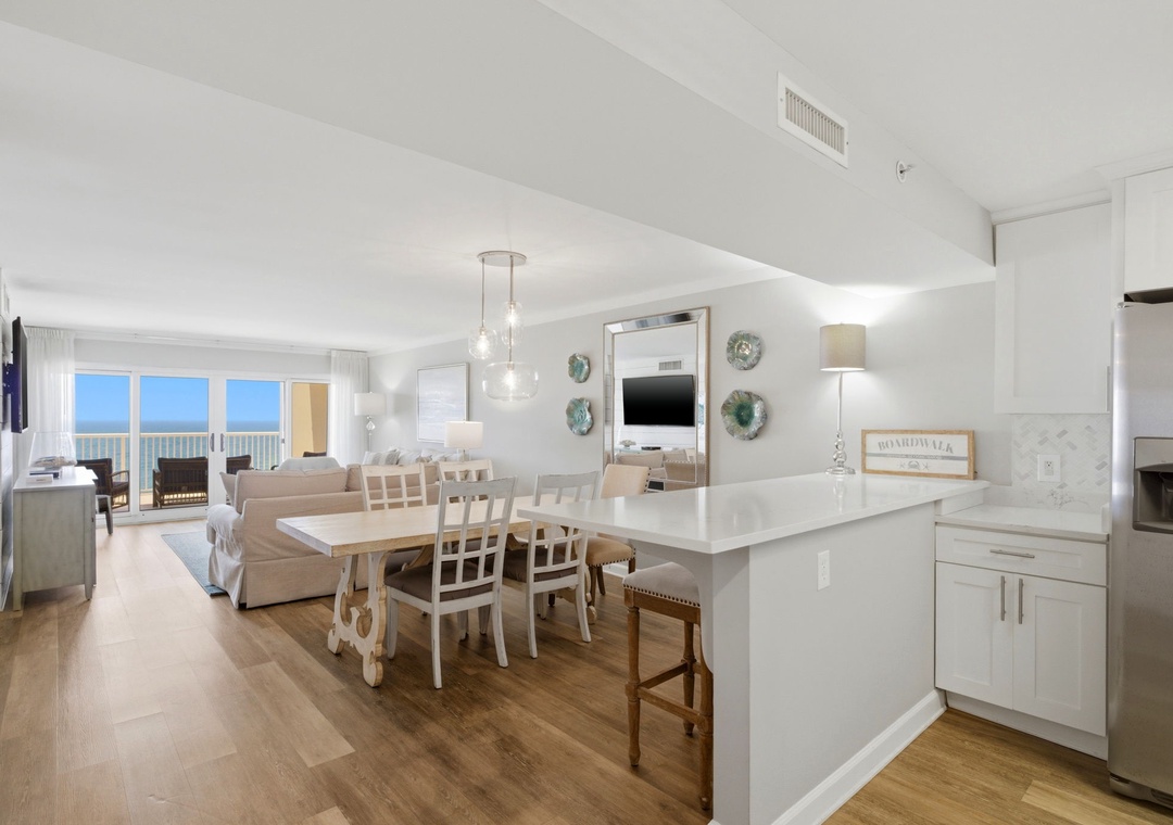 Sandy Key 827- Gather around the dining table with ocean views framing your meals, or relax in the bright living space designed for comfort and connection.