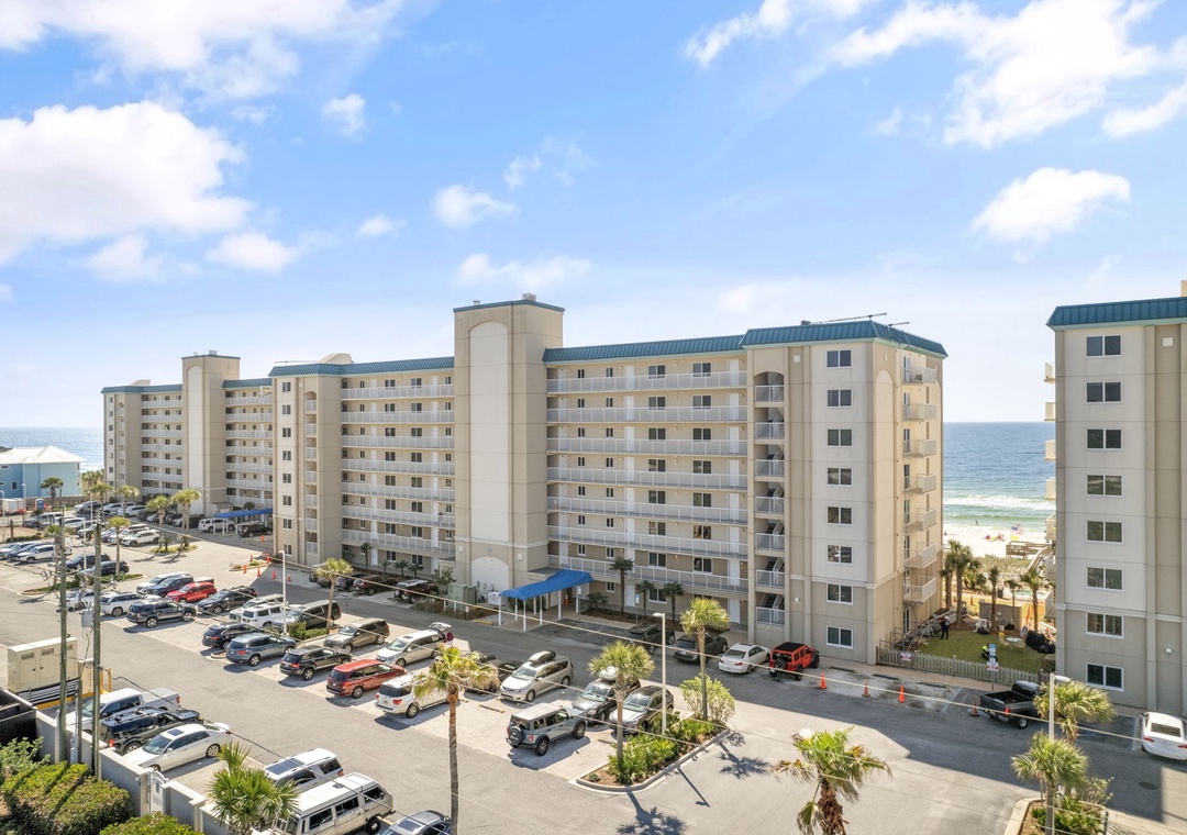 Sandy Key- Beachfront condominium building with convenient parking and easy ocean access, located in a popular coastal destination.