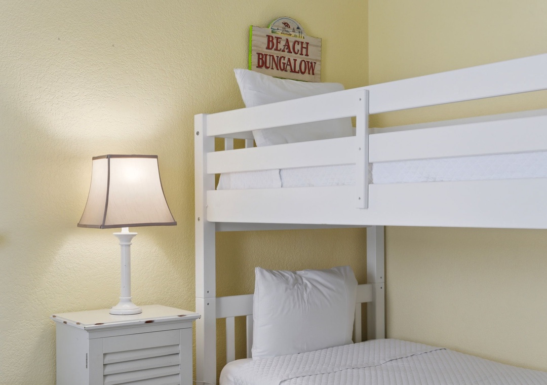 Ocean Breeze E601- Unwind in your cozy beach-themed bunk room, complete with fresh linens and a welcoming seaside vibe perfect for families or friends traveling together.