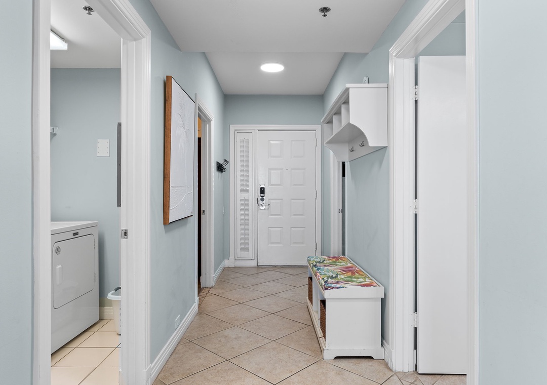 Beach Colony Tower 10C- Step into your welcoming entryway, where soft blue-gray walls and warm tile floors greet you. A handy bench with storage invites you to kick off your shoes and settle in.
