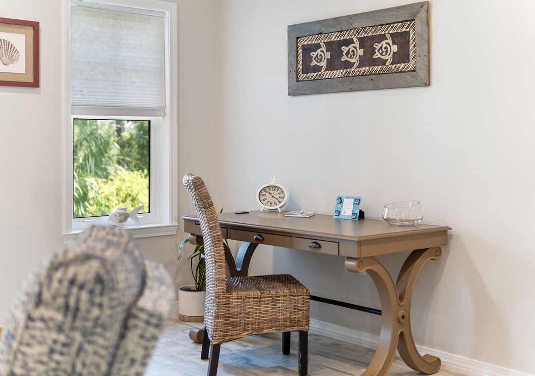 Turtles Nest- Settle in at your own peaceful workspace, where a charming desk and woven chair invite you to jot down plans or simply enjoy a quiet moment by the window.