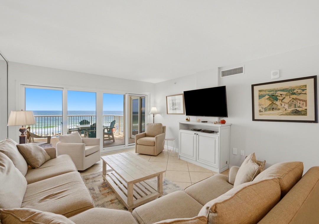 Sandy Key 318- Sink into plush sofas and enjoy breathtaking ocean views through floor-to-ceiling windows that open to your private balcony—your perfect coastal retreat awaits.