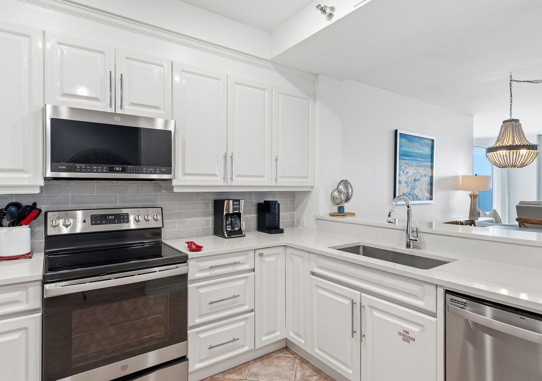 Beach Colony T14B- Your bright, fully equipped kitchen is ready for preparing everything from morning coffee to memorable vacation meals, with all the tools and appliances you'll need for a comfortable stay.