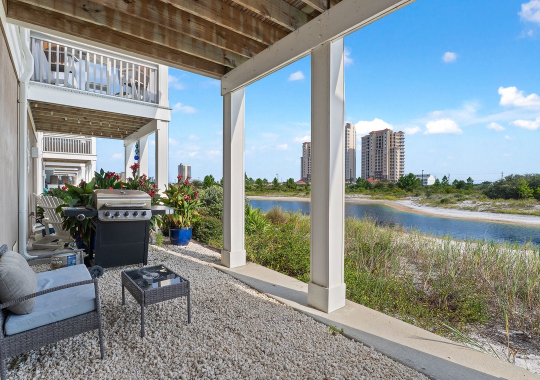 Saltwater & Sunsets- Step onto your private covered patio and take in the serene water views. Fire up the grill, relax on comfortable seating, and let the coastal breeze set the mood for your perfect getaway.