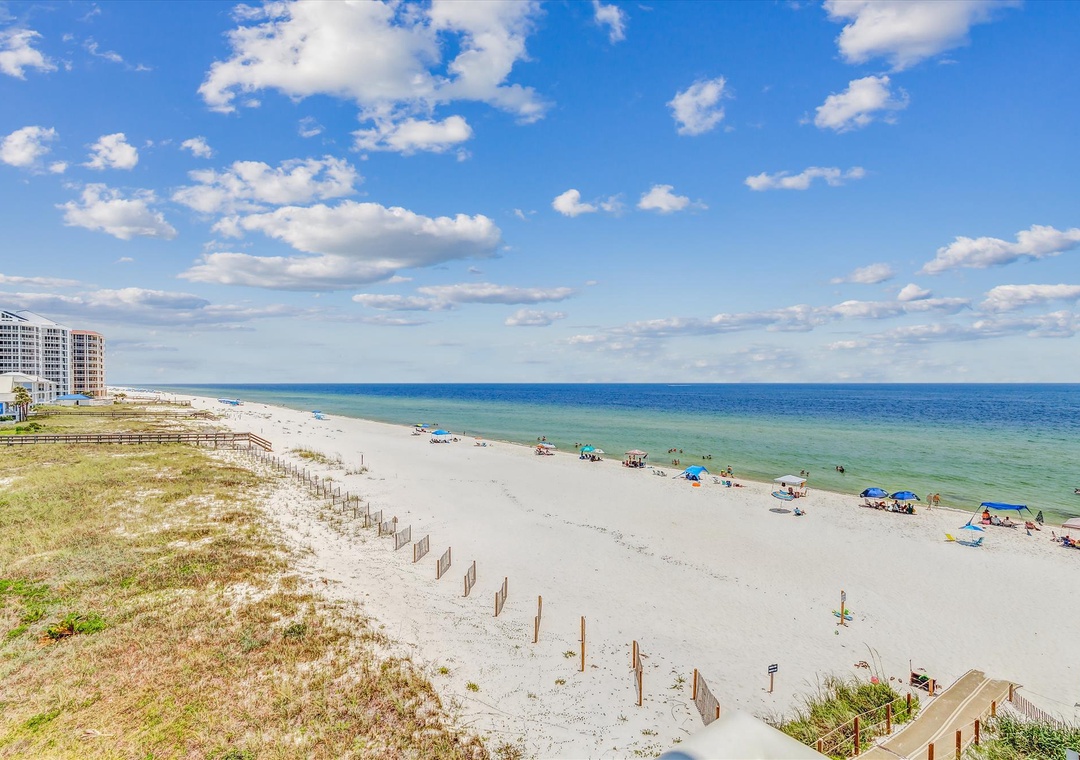 Sandy Key 411- This beachfront property sits along pristine white sands and emerald Gulf waters, offering unobstructed coastal access and a peaceful beach setting just steps away.