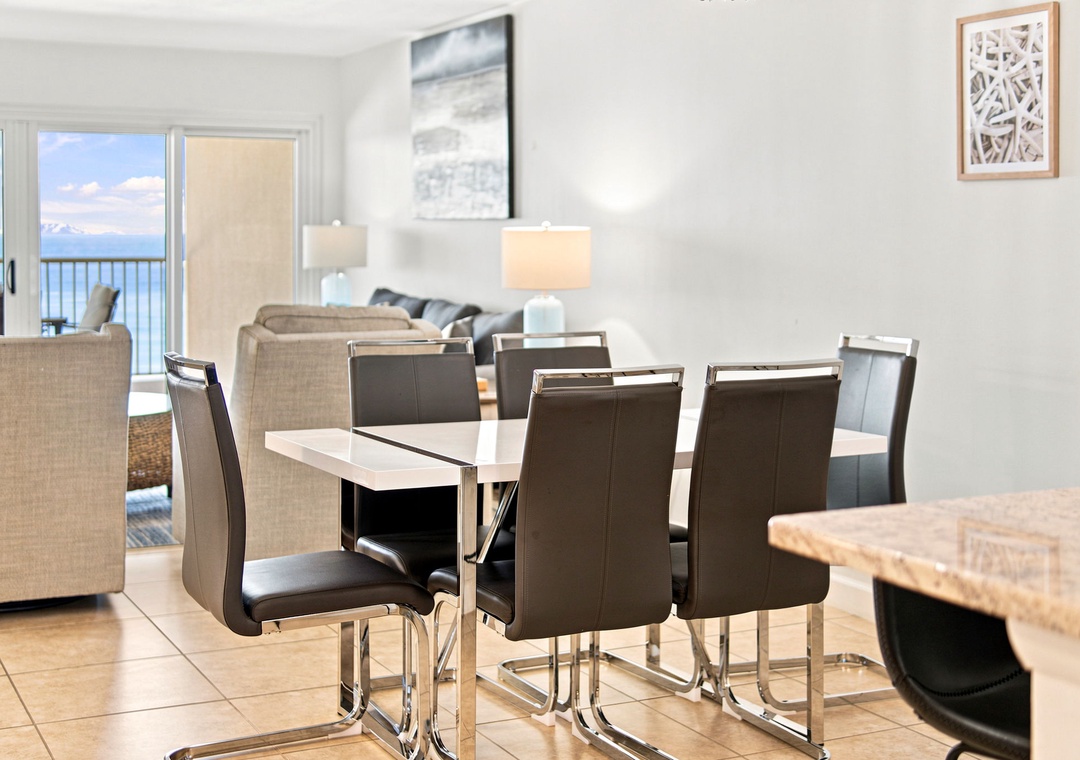 Sandy Key 411- Gather around this sleek dining table where conversations flow and meals become memories. Your open-concept space seamlessly blends coastal comfort with modern style.
