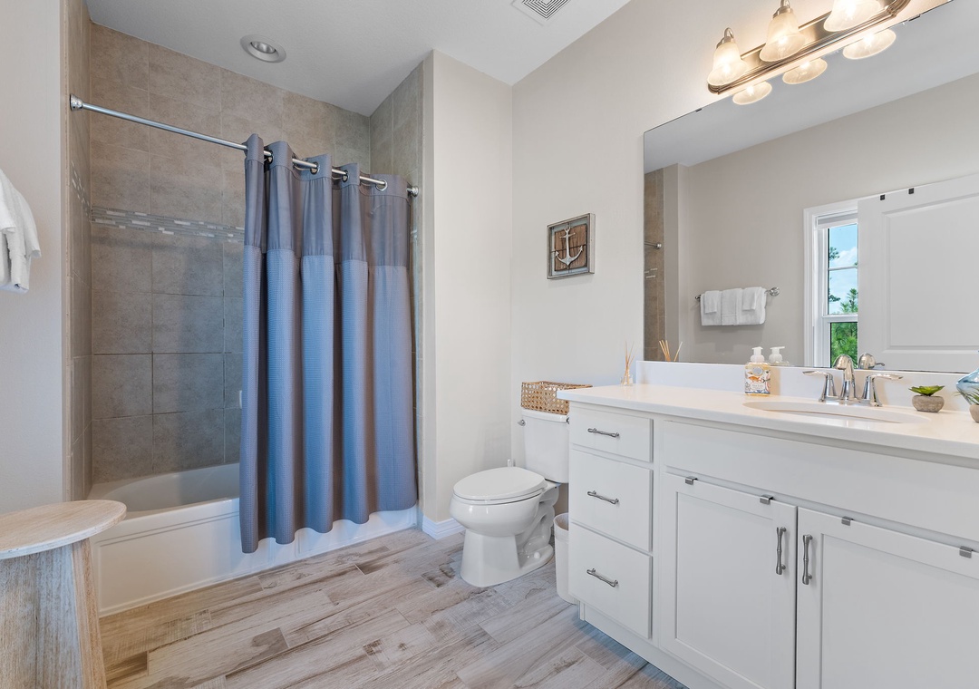 Turtles Nest- Step into your bright, beautifully designed bathroom, where a tiled walk-in shower, generous vanity, and thoughtful touches await to make your stay feel like home.