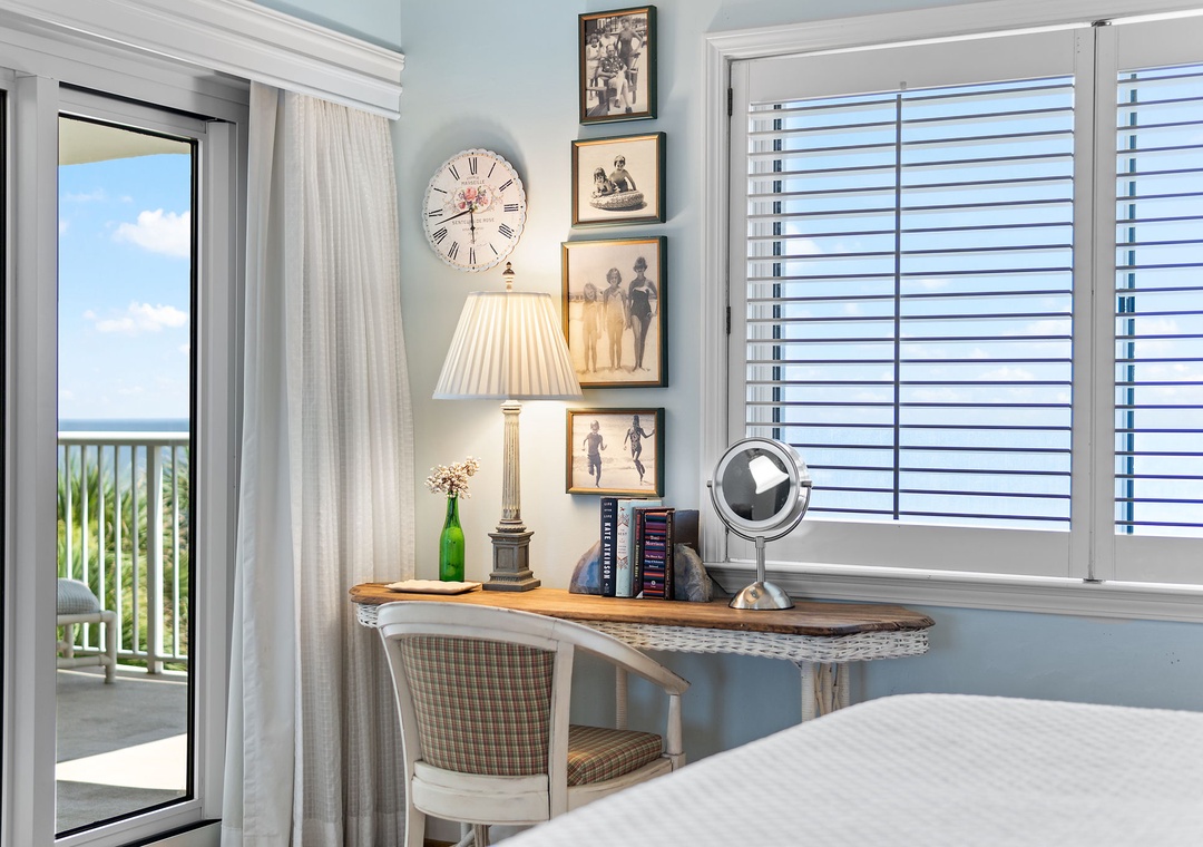 Sandy Key 338- Your private workspace features coastal charm with vintage-inspired artwork and soft natural light, while the balcony door opens to refreshing ocean breezes and serene water views.