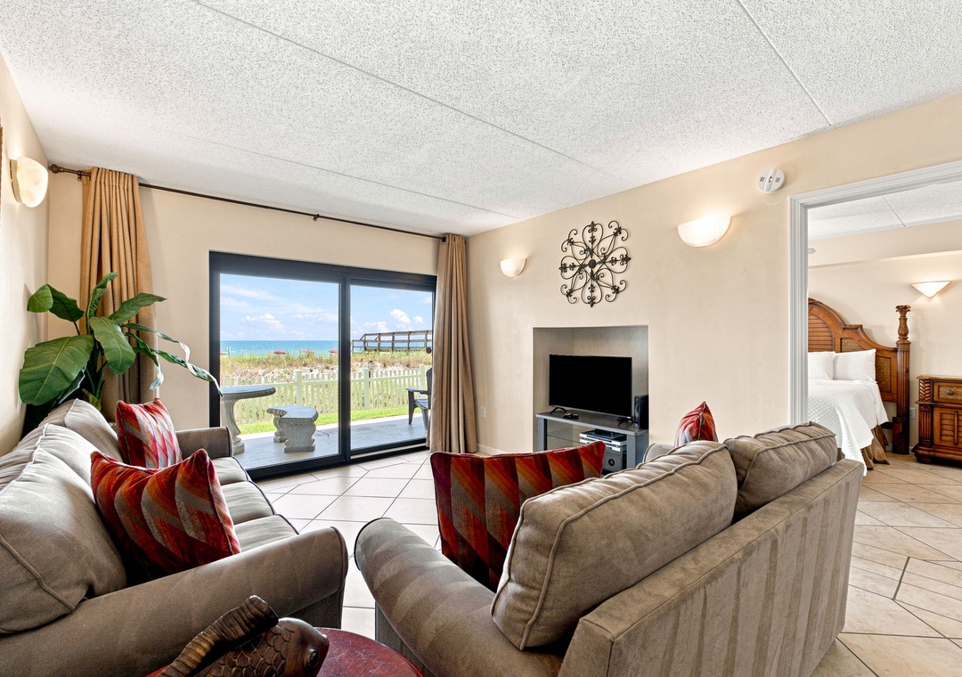 Ocean Breeze W 105- Sink into plush sofas and let the ocean view through your private patio doors remind you why you're here—to unwind, breathe deeply, and savor every moment of your beachfront escape.