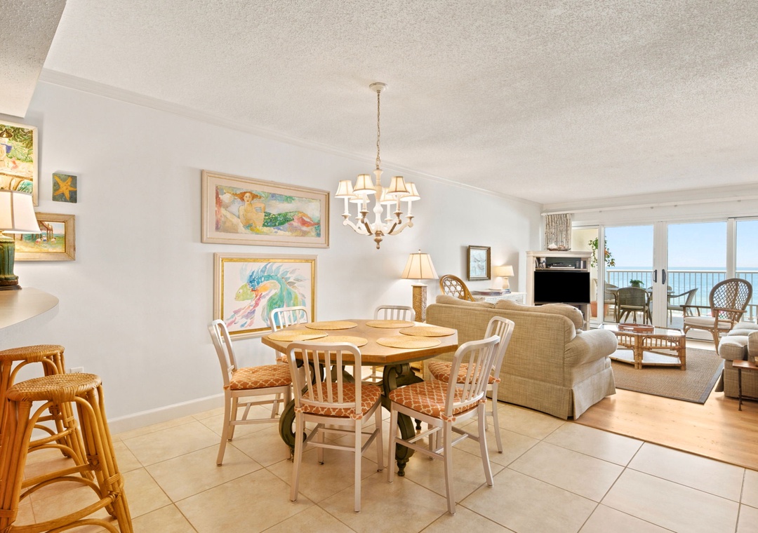 Sandy Key 338- Bright, beachy living spaces flow seamlessly from your cozy dining table to oceanfront balcony. Relax in natural light, coastal art, and views of endless blue horizons.