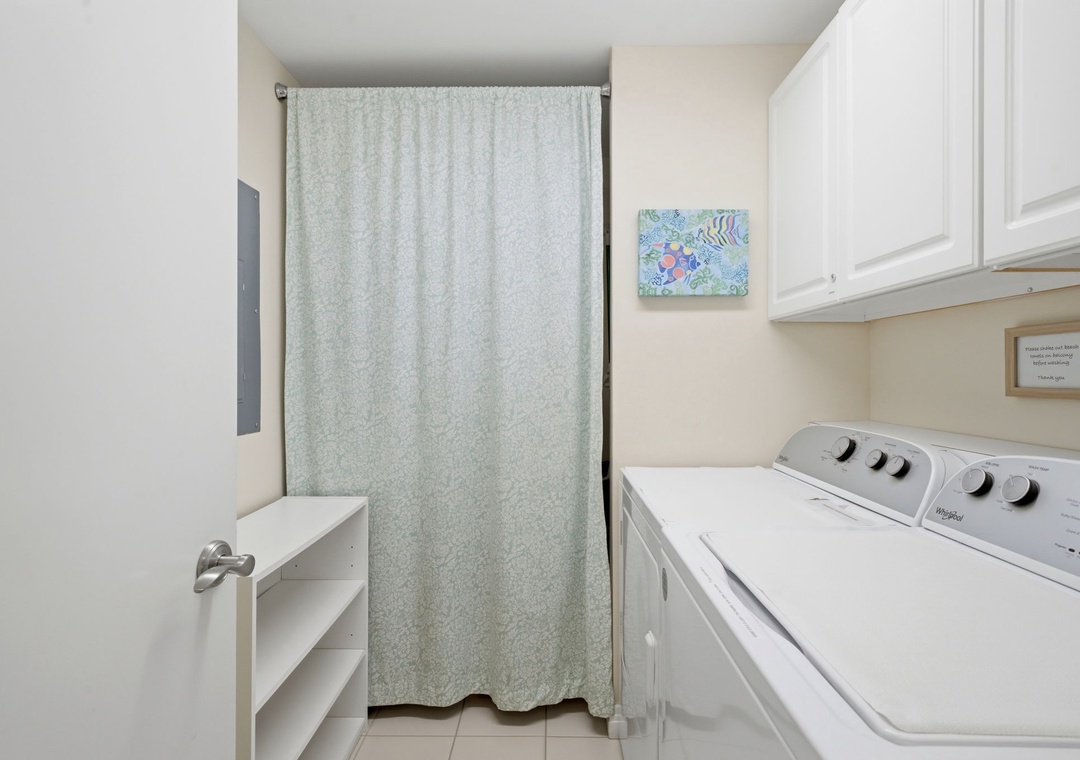 Beach Colony Tower PH1B -Your in-unit laundry room features a full-size washer and dryer, plus thoughtful storage and a cheerful coastal touch—making it easy to pack light and stay fresh.