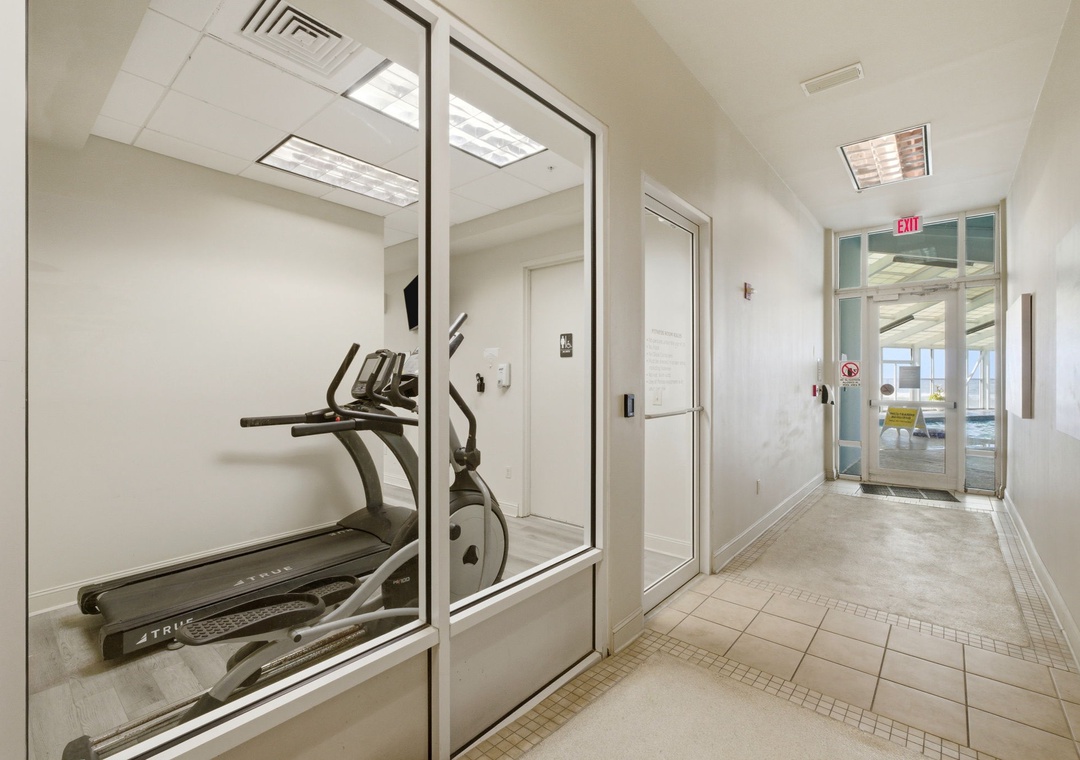 Modern fitness center featuring cardio equipment in a bright, climate-controlled space with convenient access from the main lobby area.