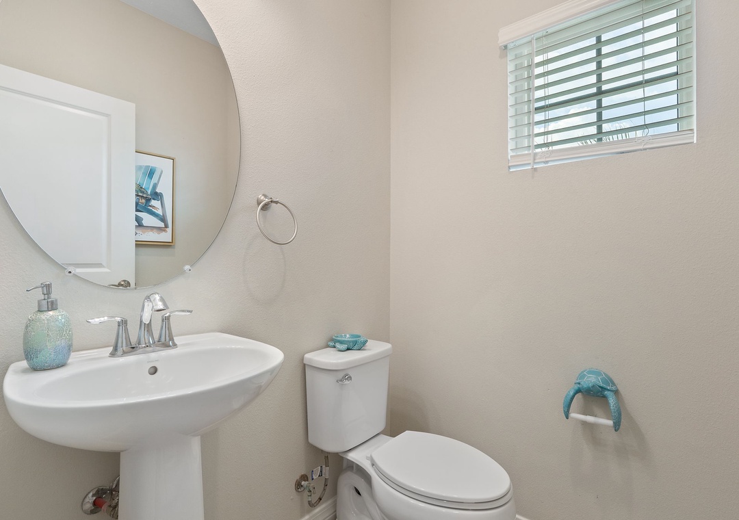 Saltwater & Sunsets- Your private powder room offers a bright, clean space with coastal-inspired accents and plenty of natural light—a perfect blend of comfort and style.