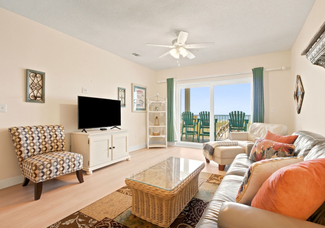 Unwind in your bright living room where ocean breezes and stunning views await. Sink into plush seating and picture yourself here, coffee in hand, as coastal calm fills your space.