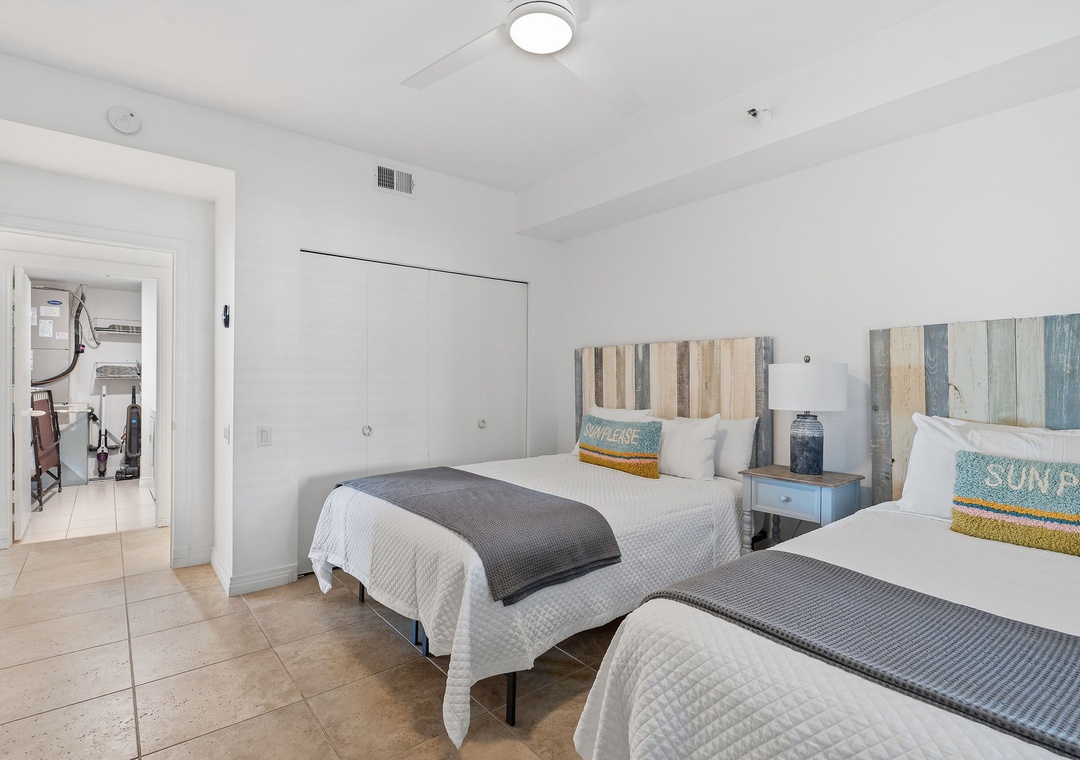 Beach Colony T14B- Settle into your bright, beach-inspired retreat with two cozy beds and coastal touches that welcome you home after sunny days exploring.