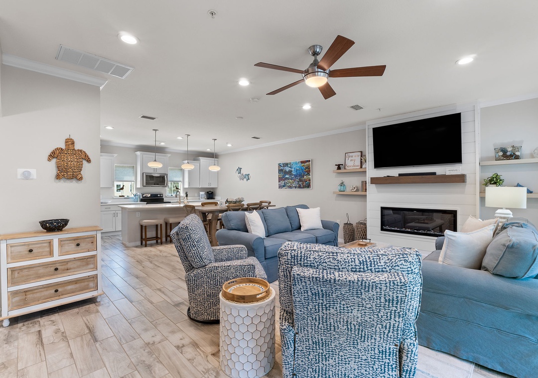 Turtles Nest- Settle in and feel right at home in this bright, open living space styled with coastal charm. You'll love the cozy fireplace for cooler nights and the seamless flow into your well-equipped kitchen.