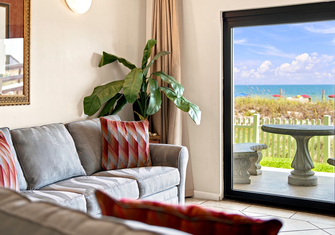 Ocean Breeze W 105- Step into your inviting living room where plush seating and vibrant coastal accents meet stunning ocean views through your glass doors. The perfect retreat to unwind after sunny beach days.
