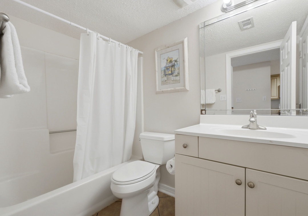 Ocean Breeze E702- Step into your bright, spotless bathroom with soft towels waiting, a spacious vanity for your essentials, and a refreshing shower to start or end your day feeling renewed.