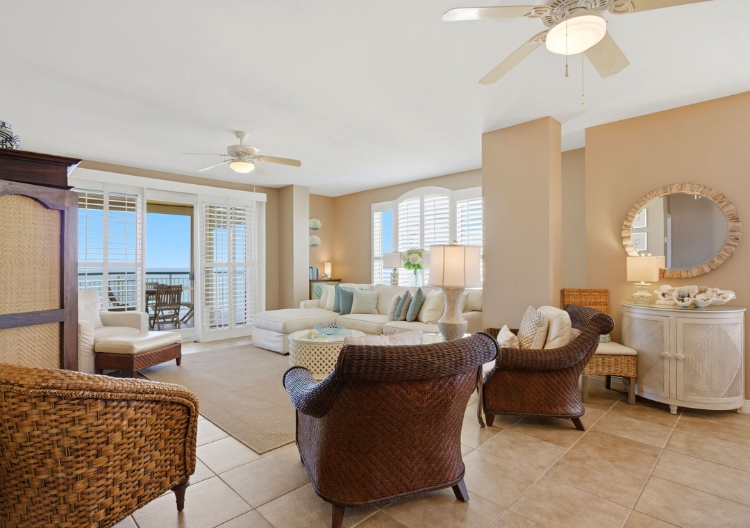 Beach Colony T PH1D- Relax in this breezy coastal living room where comfortable woven furniture and soft ocean breezes invite you to unwind. Step onto your private balcony to soak in the stunning views.
