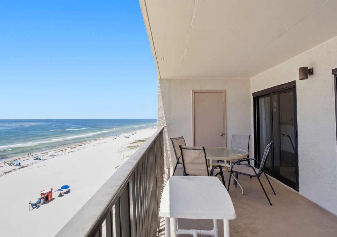 Ocean Breeze E702- The balcony offers breathtaking Gulf views, where you'll find seating for morning coffee or sunset watching, with direct sightlines to pristine white sand and turquoise waters below.