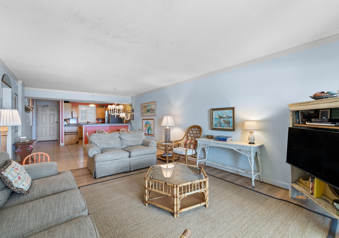 Sandy Key 338- Relax in this bright coastal living room with soft seating, beachy decor, and an open layout that connects to your fully equipped kitchen.