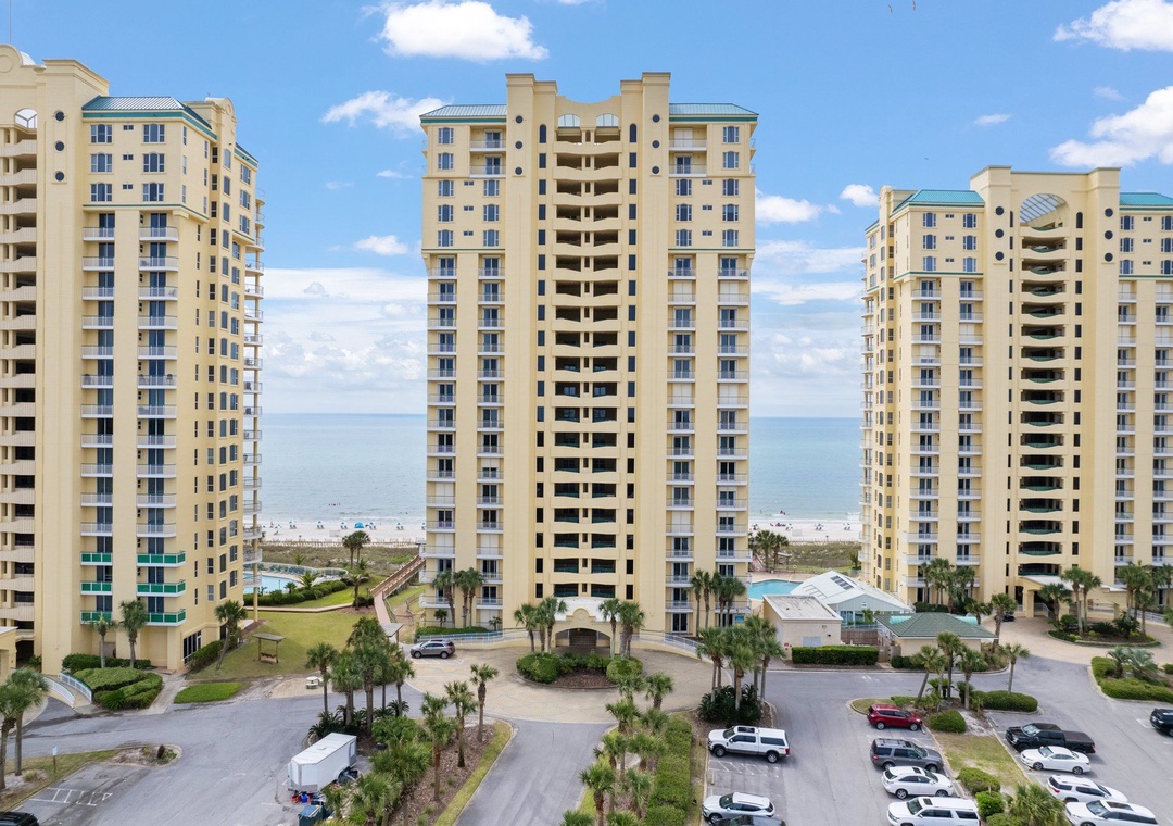 Beach Colony Tower Beachfront condominium towers with direct beach access, swimming pools, and landscaped grounds positioned along a pristine coastal stretch.