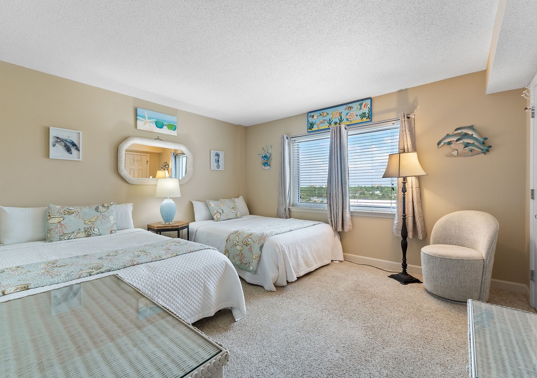 Sandy Key 628- Drift off in your serene coastal retreat with two plush beds, soothing ocean-inspired decor, and soft natural light streaming through the windows to greet you each morning.