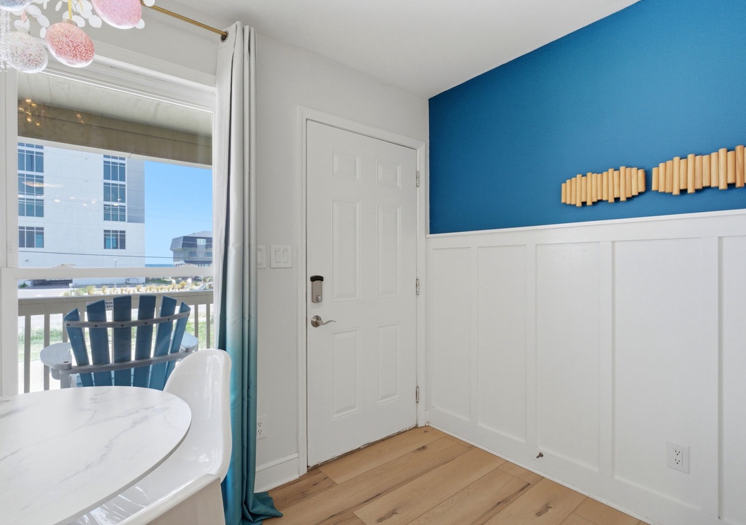 North Lost Key Landing B2- Your bright coastal retreat features charming details and a private balcony with an inviting outdoor chair, perfect for morning coffee or evening relaxation.