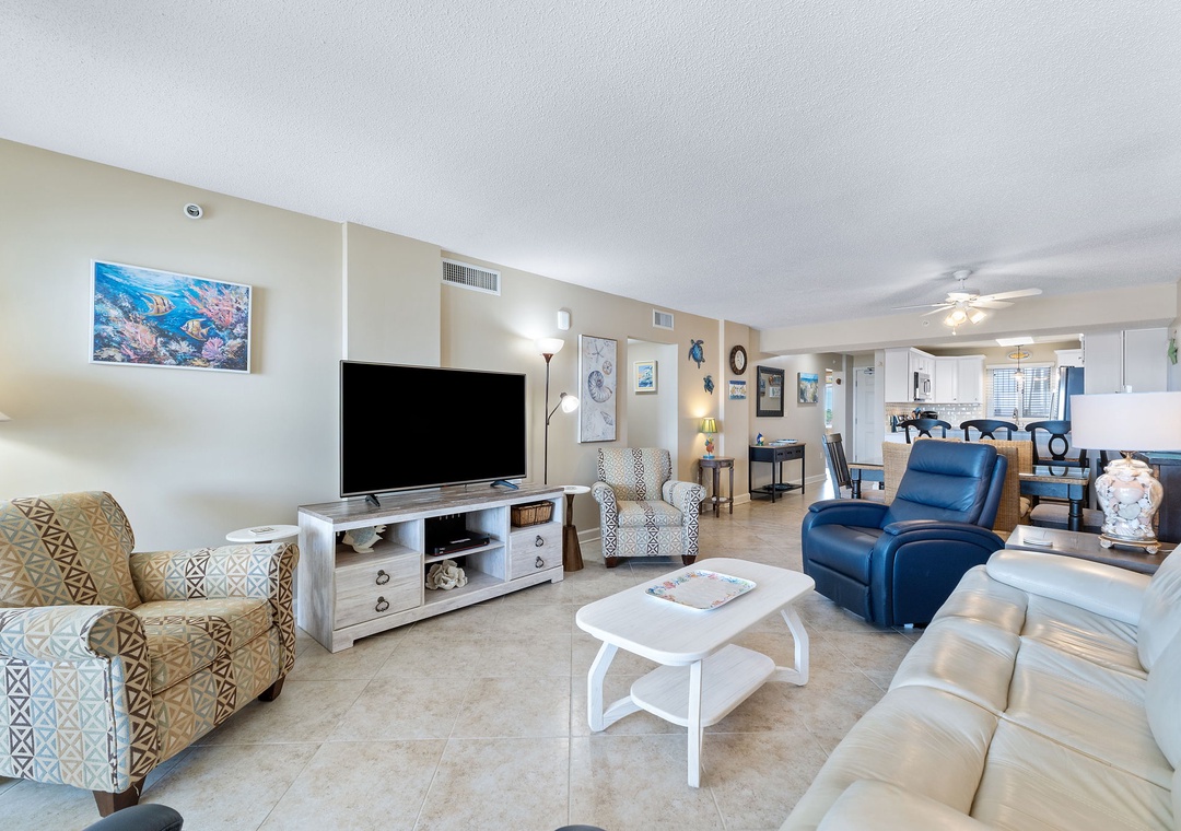 Sandy Key 628- Step into your spacious coastal haven, where plush seating invites you to unwind in style. The open-concept layout flows effortlessly to the dining area, perfect for your morning coffee or evening gatherings.