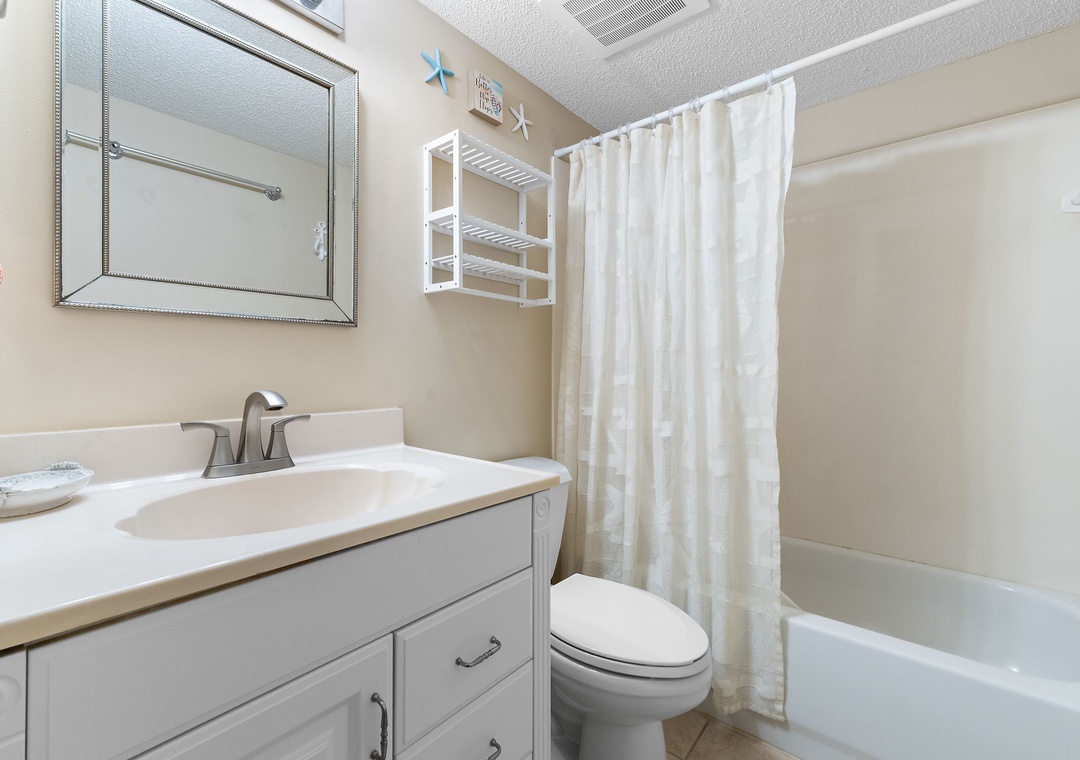 Sandy Key 628- Step into your own refreshing bathroom with a spacious walk-in shower, crisp linens, and elegant touches that make getting ready a pleasure. It's your private retreat to unwind and recharge.