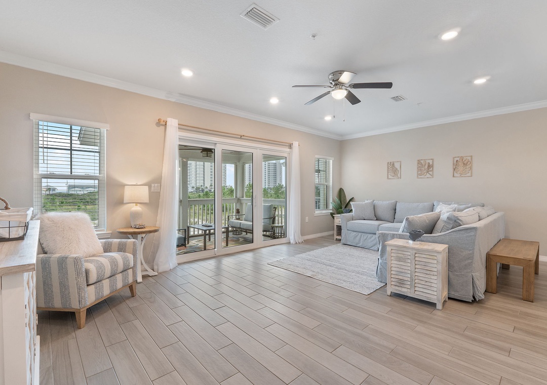 Saltwater & Sunsets- Your bright, coastal-inspired living space opens to a covered balcony, inviting you to relax in the gentle gulf breeze. Soft neutrals and natural textures create a calm retreat after beach days.