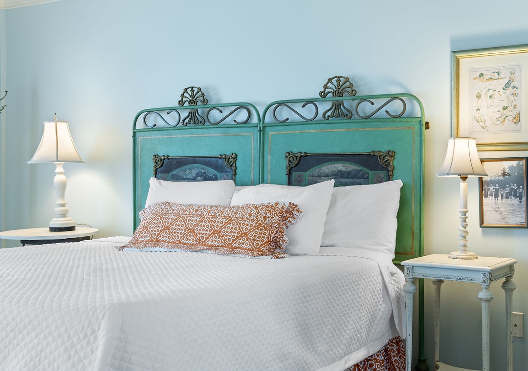 Sandy Key 338- Sink into crisp, cloud-like linens beneath a charming vintage headboard. Soft bedside lamps and cheerful coastal hues wrap you in comfort after a day of exploring.