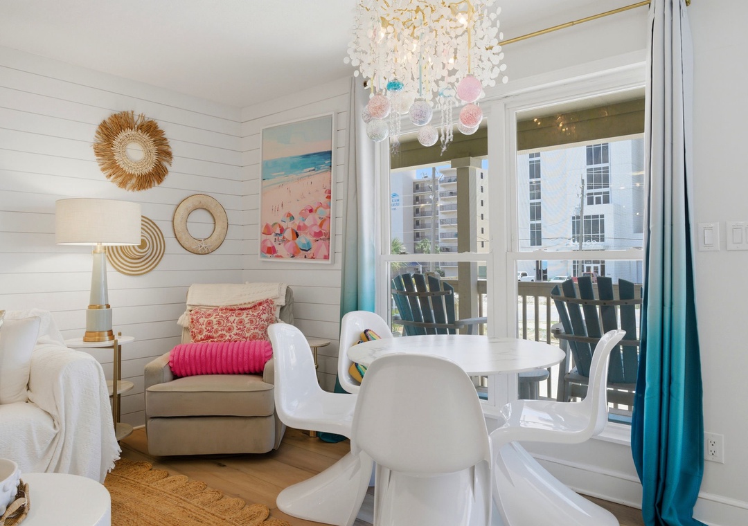 North Lost Key Landing B2- Relax in your coastal-inspired retreat with beach art, a chic chandelier, and charming seating. Step out to your private balcony to soak in the sunny surroundings.