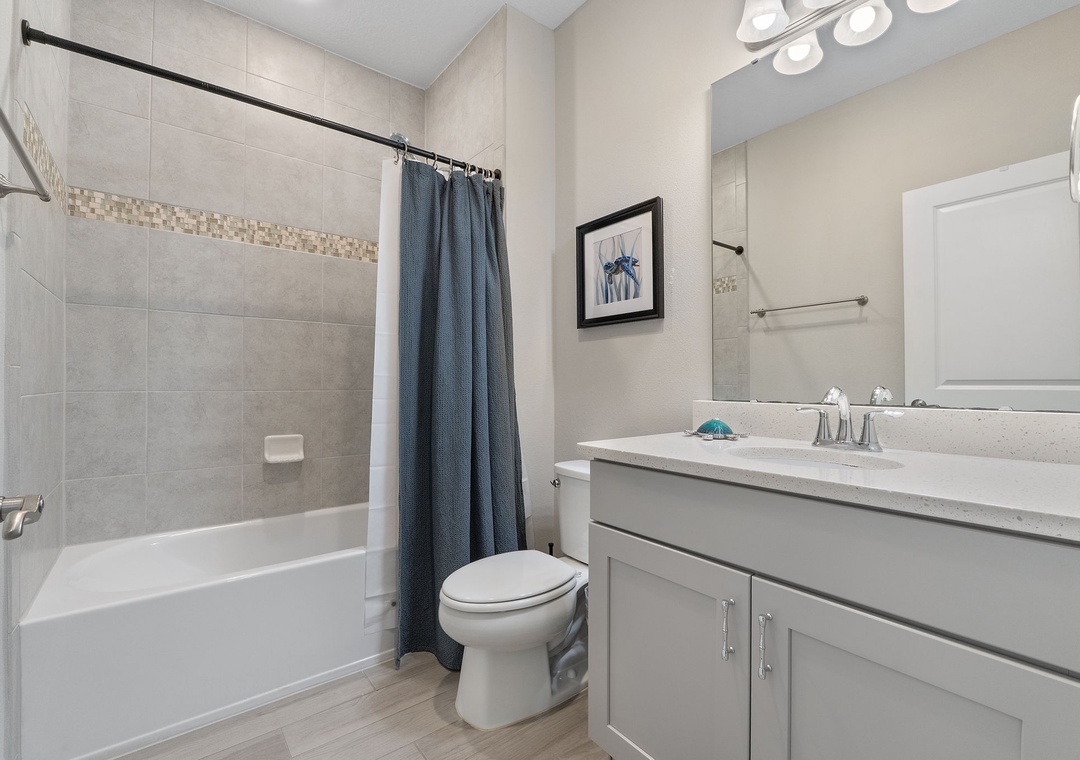 Saltwater & Sunsets- Step into your private sanctuary with modern tile work, a soothing neutral palette, and thoughtful details that make freshening up feel effortless. You'll find everything you need for a relaxing stay right here.