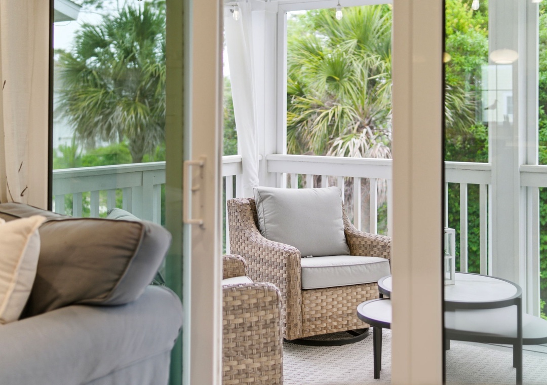 Turtles Nest- Step onto your private balcony, where wicker seating and lush tropical greenery create the perfect spot to unwind with your morning coffee or evening breeze.