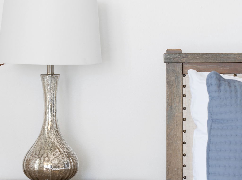 Beach Colony T14B- Your bedside retreat awaits, with coastal textures and soft linens inviting peaceful rest after a day of exploring.