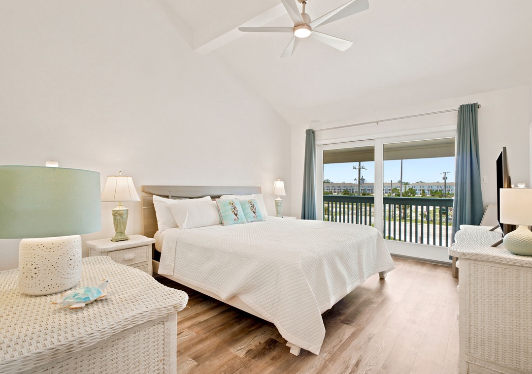 Gulfside Villas 2B- Picture yourself waking up to serene waterfront views from your airy bedroom. Coastal breezes drift through while you relax in comfort beneath vaulted ceilings and modern amenities.