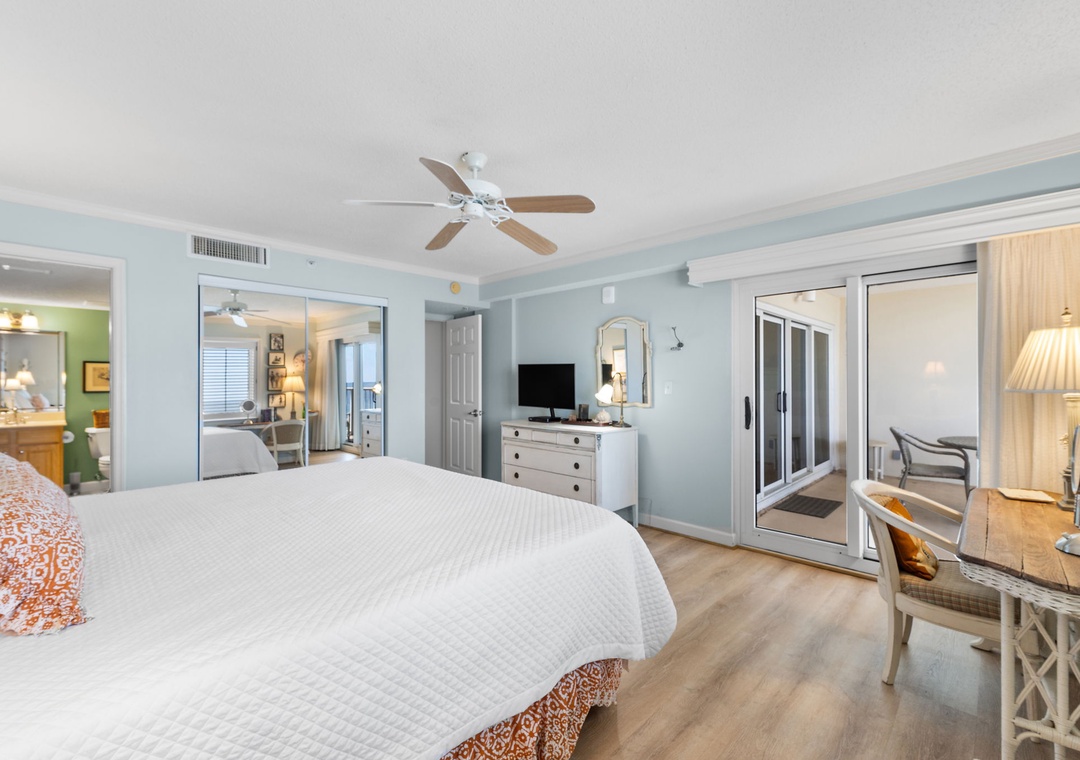 Sandy Key 338- Wake up to light-filled mornings in your serene bedroom. Coastal-inspired tones, a plush bed, and glass doors leading to your private balcony make every day feel like vacation.