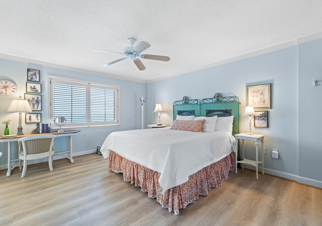 Sandy Key 338- Drift off in this serene bedroom with soft coastal tones, charming vintage touches, and gentle ceiling fan breezes to keep you cool.