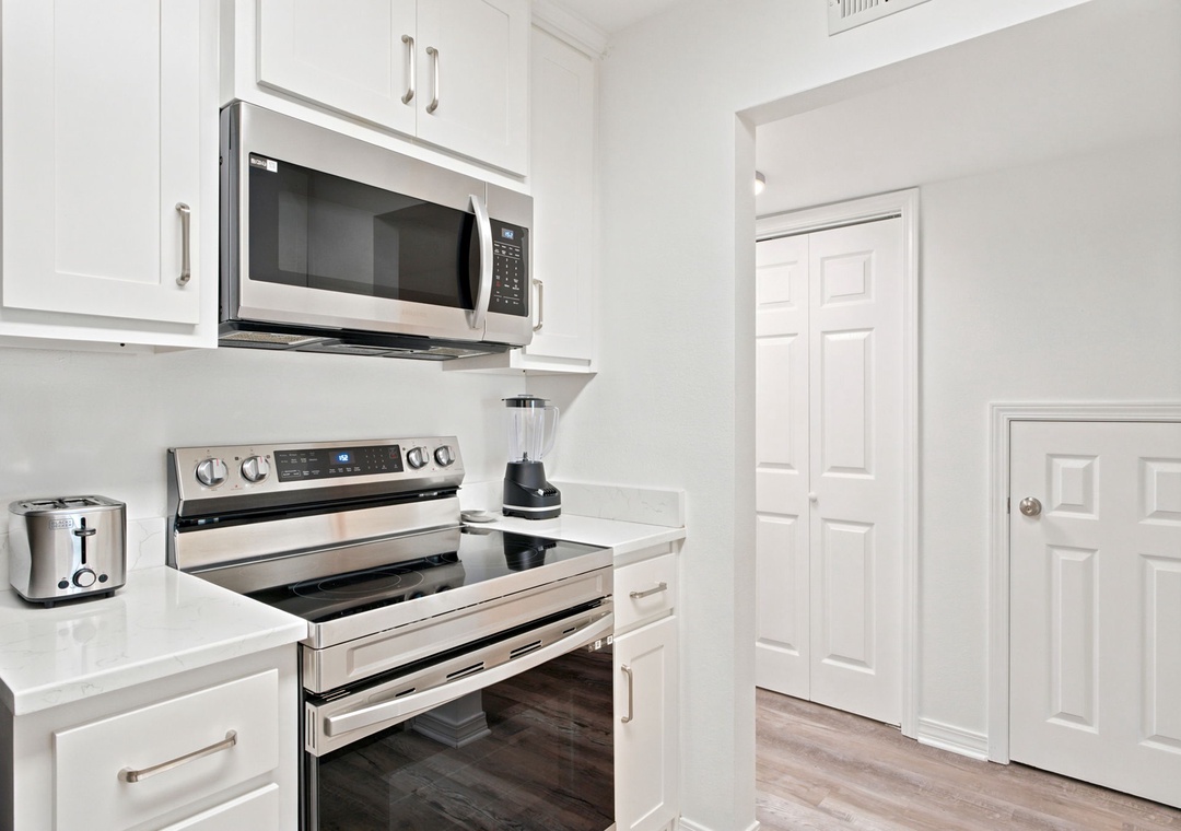 Gulfside Villas 2B- Your bright, modern kitchen with stainless steel appliances, sleek countertops, and smart layout makes meal prep feel effortless and enjoyable.